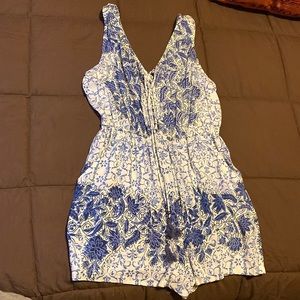 Blue and white romper with a tie up chest area.